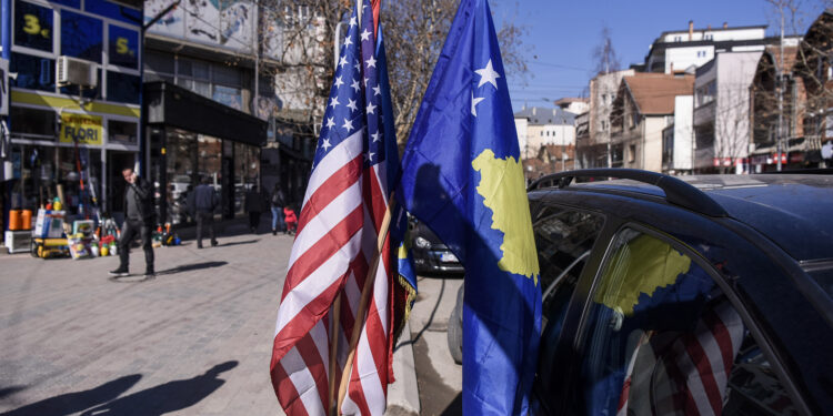 U.S. and Kosovo flags displayed for sale in the street in the town of Mitrovica on March 4, 2019.